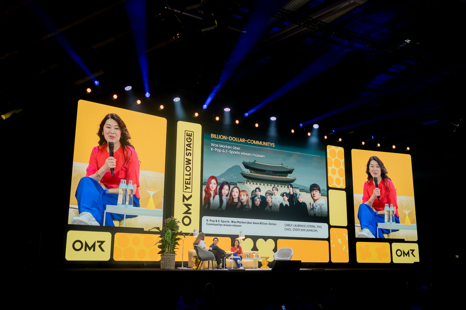 Steffi Kim speaking on the OMR Yellow Stage about K-pop and fan communities